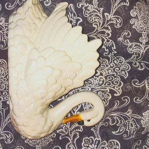 Bone White china Swan vessel it is 8 inches long 5 inches tall very pretty.